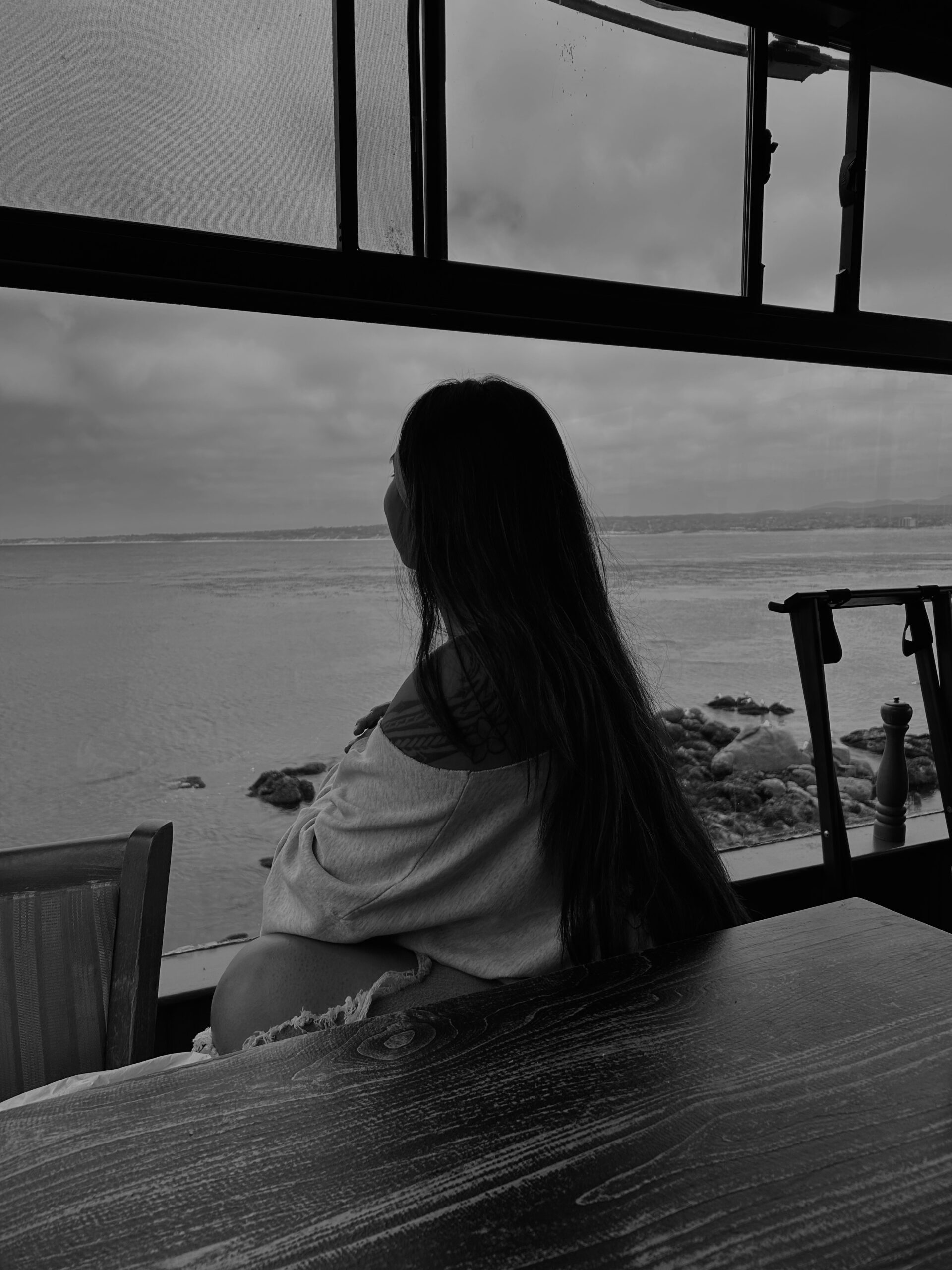 girl looking over the water at a restaurant