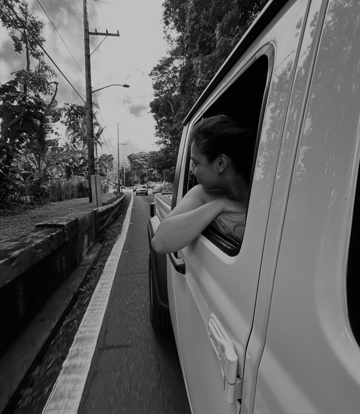 a girl putting her head out the window